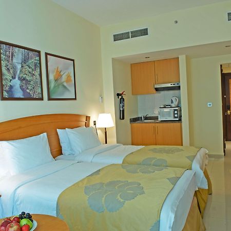 Golden Tulip Sharjah Aparthotel Bagian luar foto