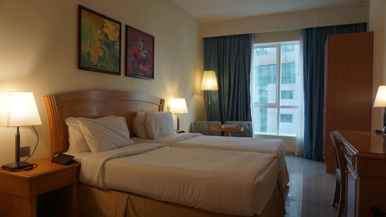 Golden Tulip Sharjah Aparthotel Bagian luar foto