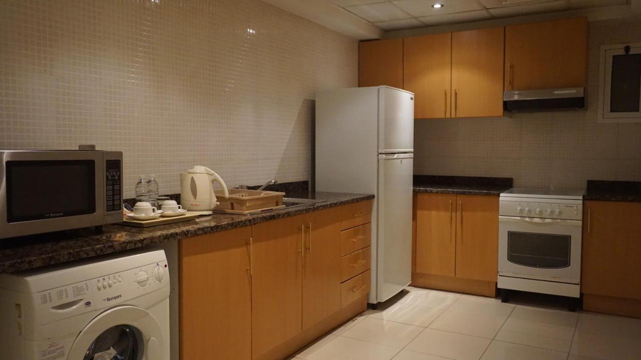 Golden Tulip Sharjah Aparthotel Bagian luar foto